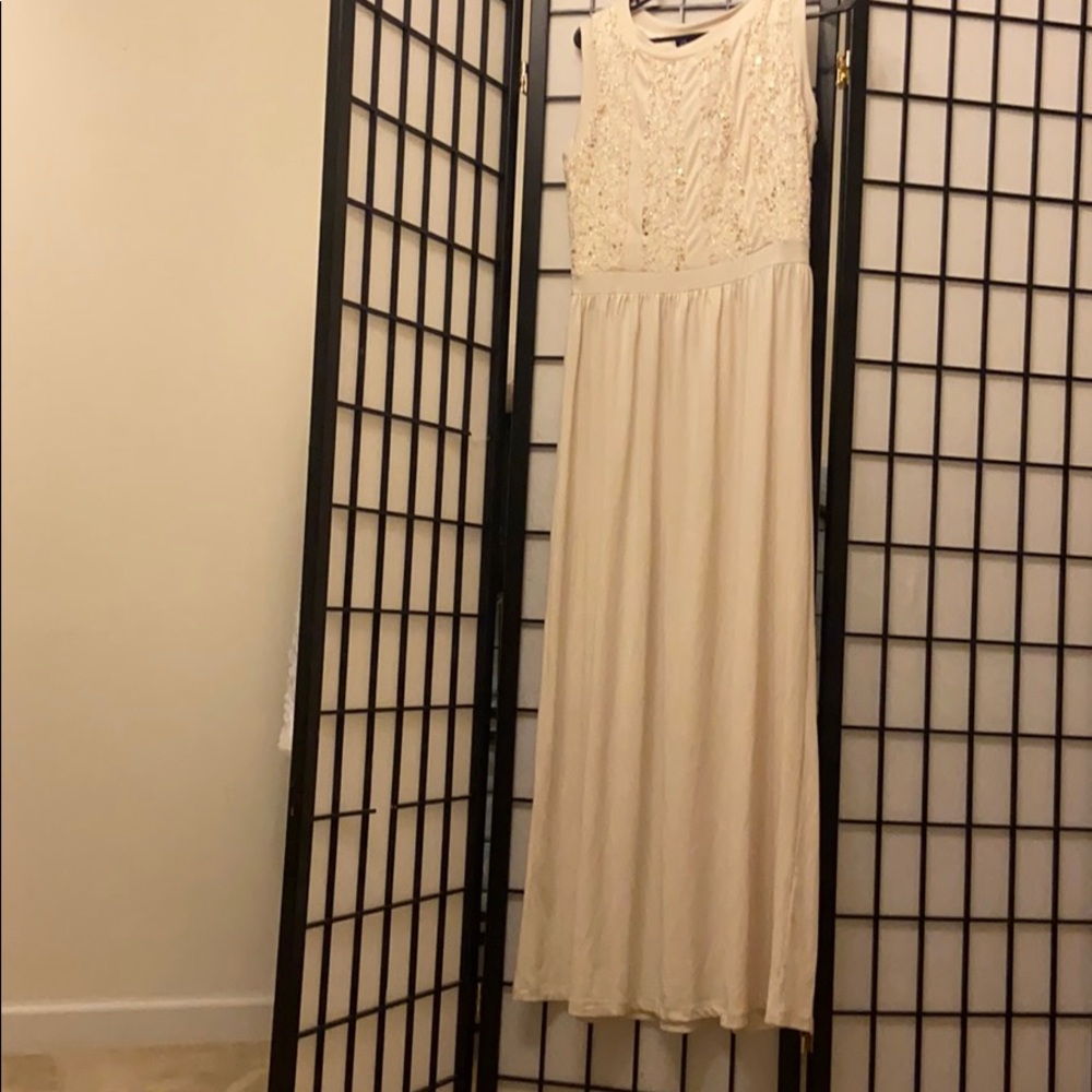 Cream colored elegant dress.